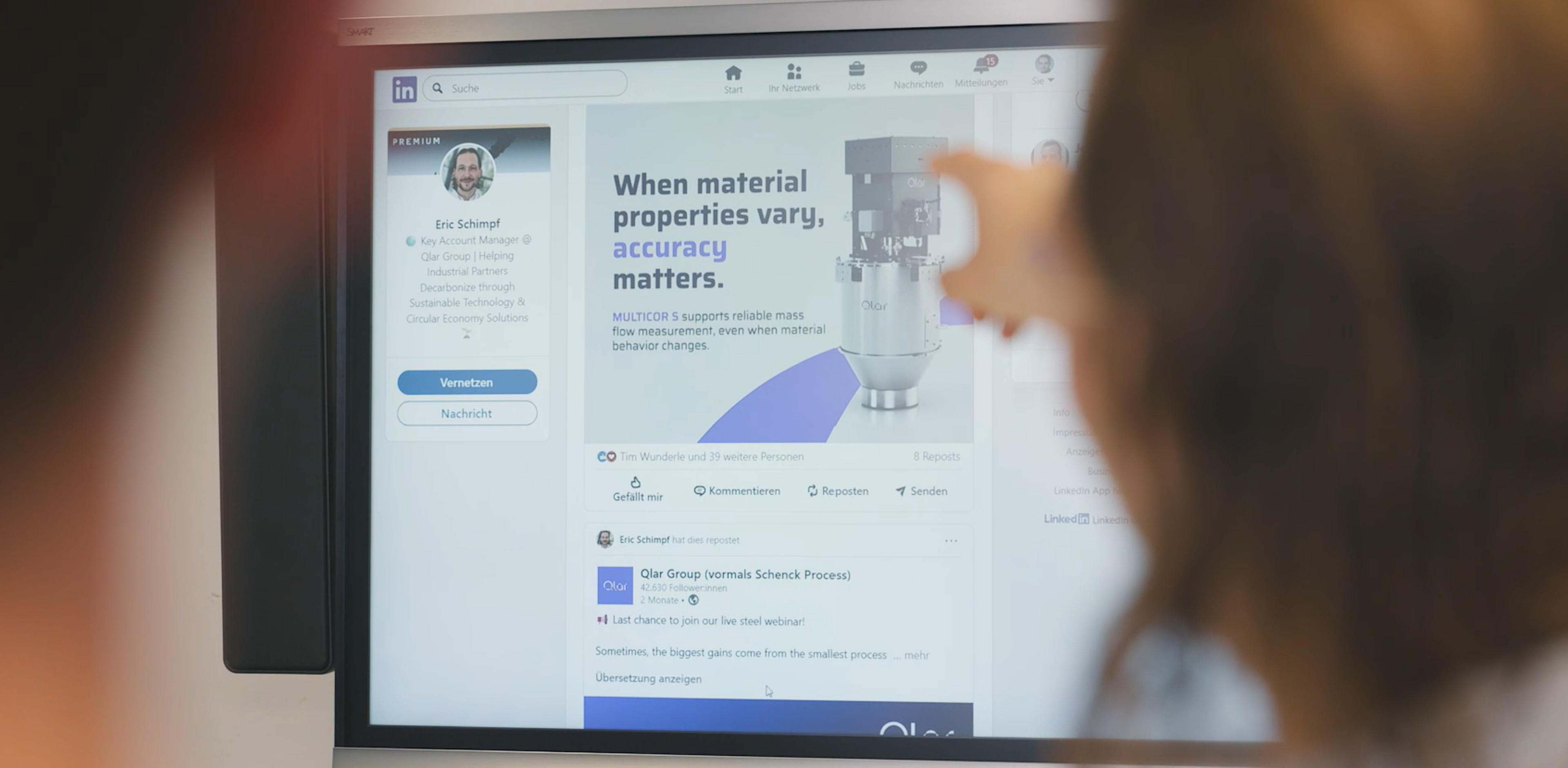 LinkedIn profile of Eric Schimpf, Key Account Manager at Qlar, with a product post on a screen, scene from the customer case video